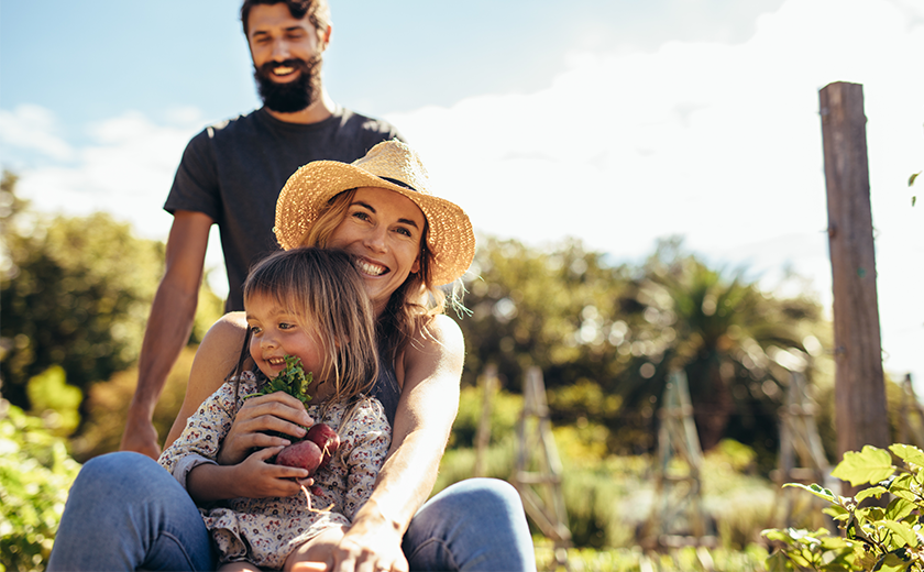 young family on a farm in the sun