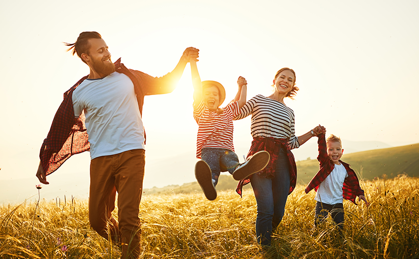 family walking together in the sunshine