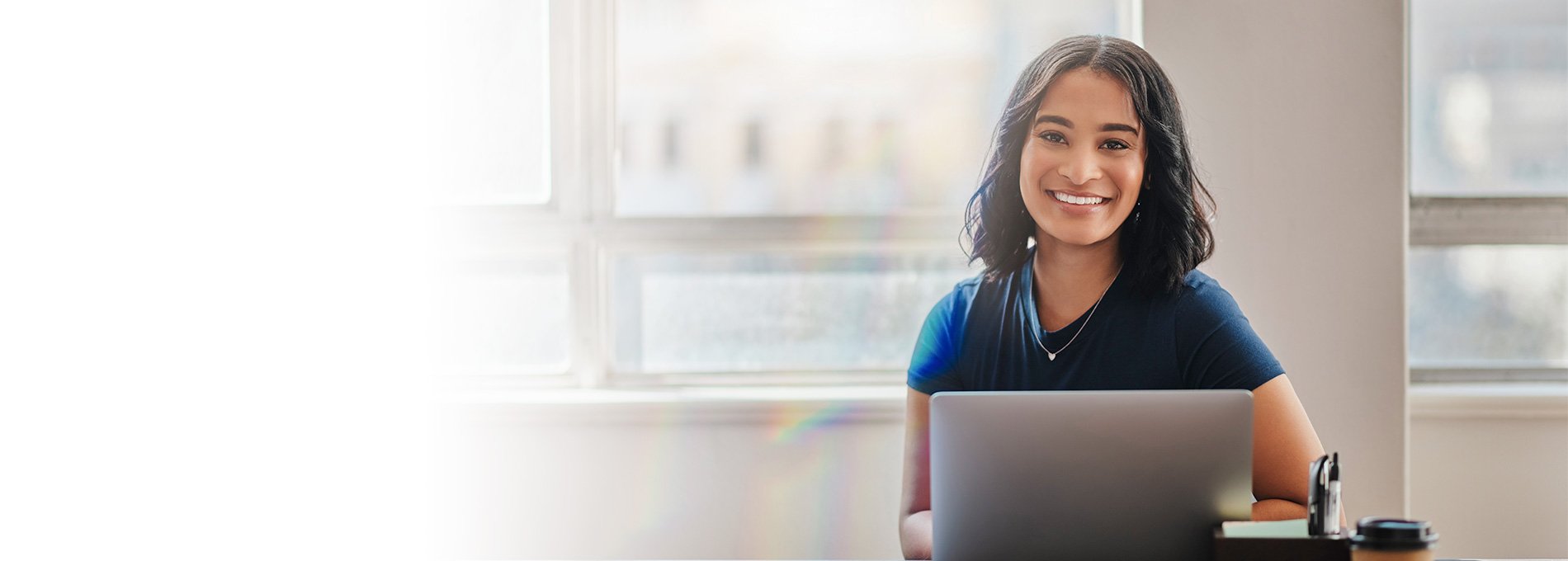 young professional woman working on a laptop