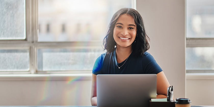 young professional woman working on a laptop